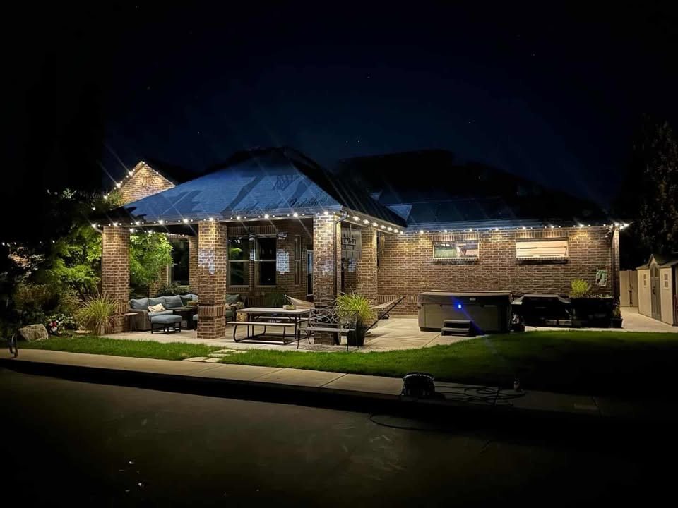 Back patio pergola and roofline wrapped in warm white Ember lighting